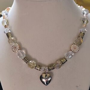 Elegant Gold and Silver Necklace with Heart Pendant and Floral Accents